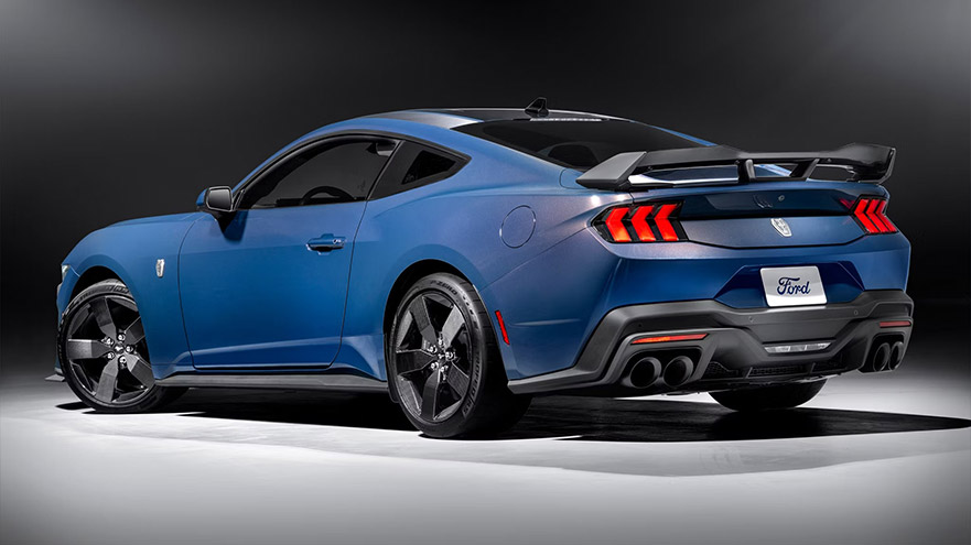 Blue Ford Mustang GT with black accents, rear view, showcasing sleek design and powerful performance
