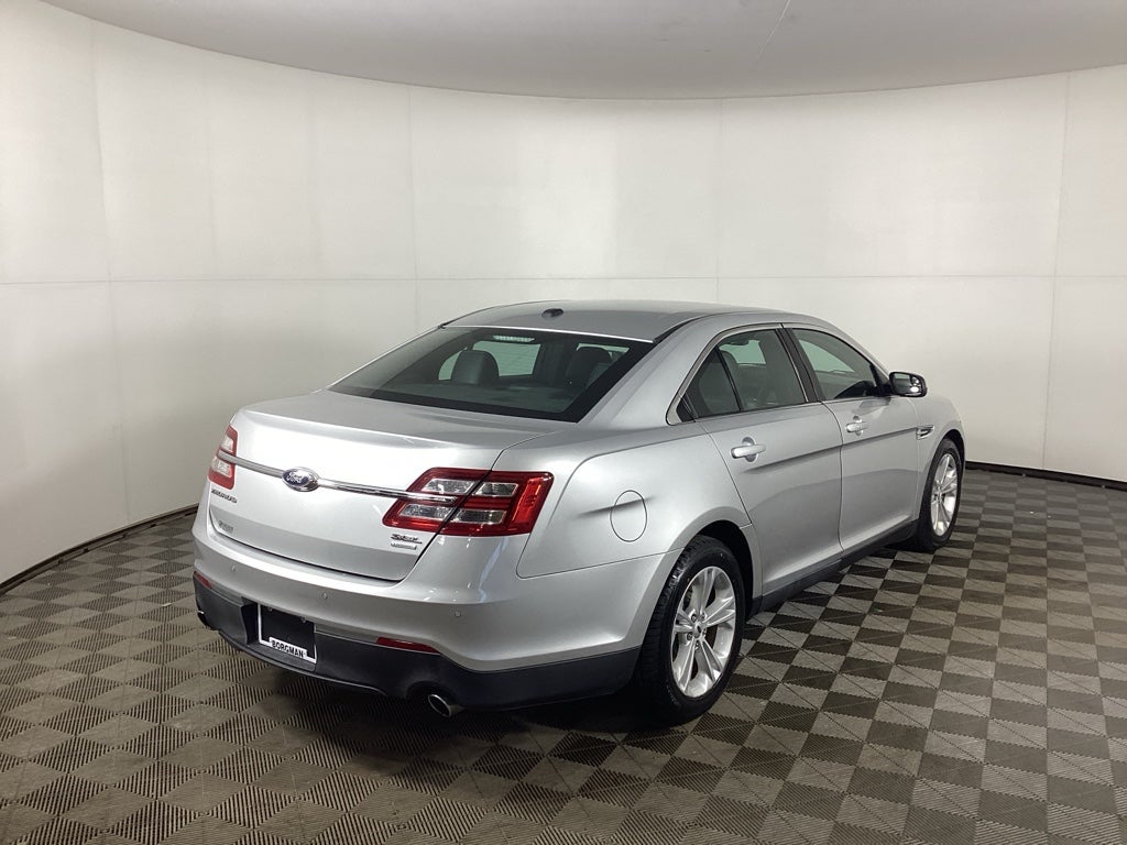 Used 2015 Ford Taurus SEL with VIN 1FAHP2E97FG103391 for sale in Grandville, MI